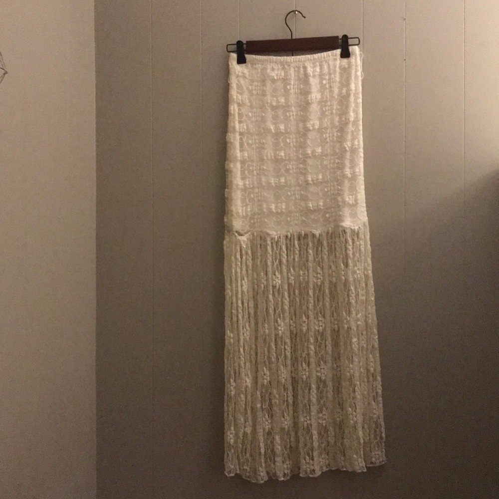 Light creamy white lace skirt.